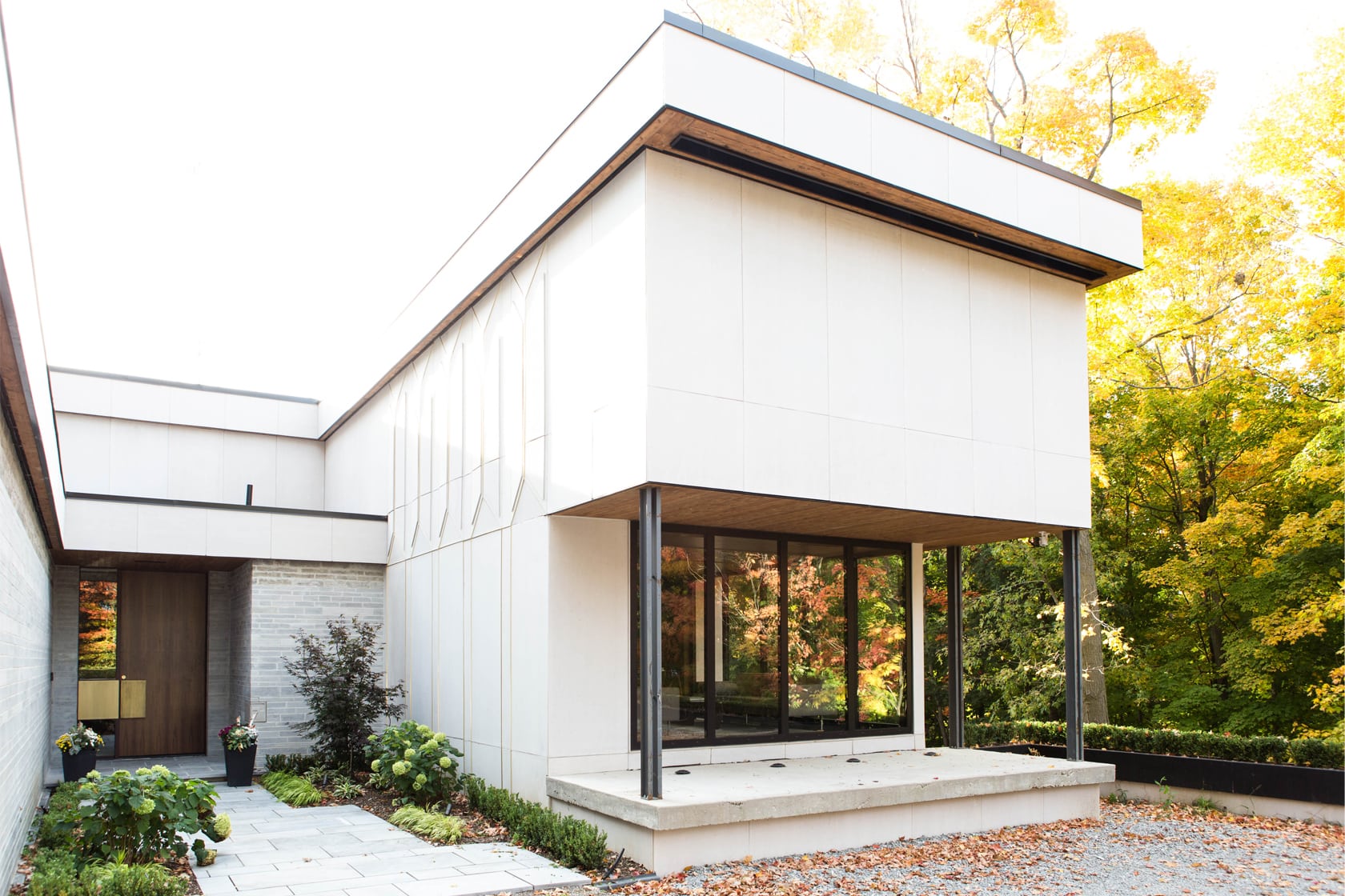 Woodland House by FrankFranco Architect using simple materials in soft colors to create a beautiful custom home design.