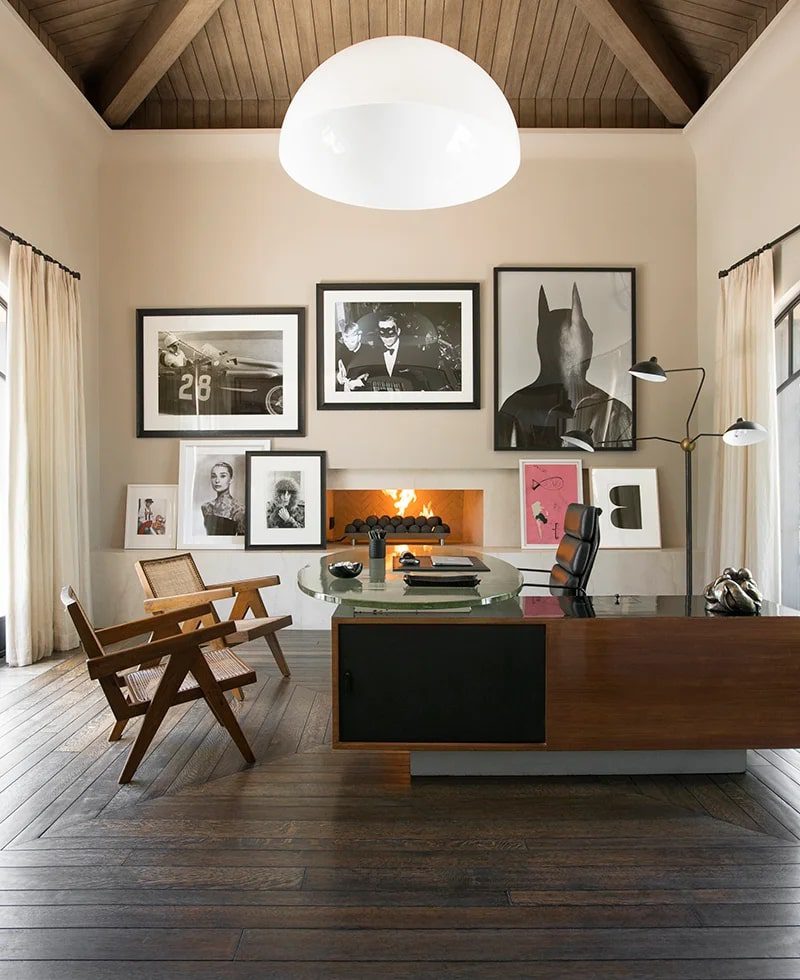Kourtney Kardashian's large custom designed and built home office featuring artwork on the walls.