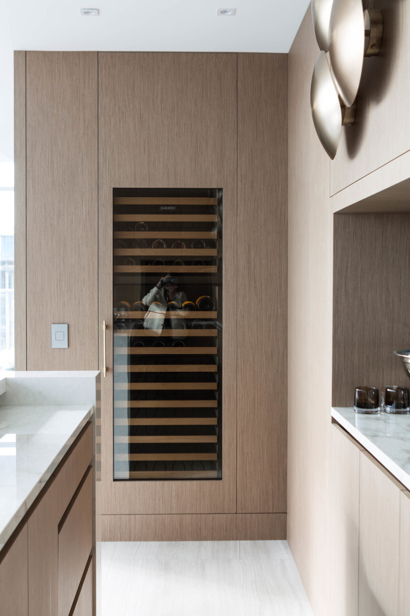 Beautiful self-contained wine refrigeration system flushed into a residential wall's homes is a feature you should incorporate in a wine cellar design. Read more to find out how to elevate your wine cellar build in this article by FrankFranco Architects.