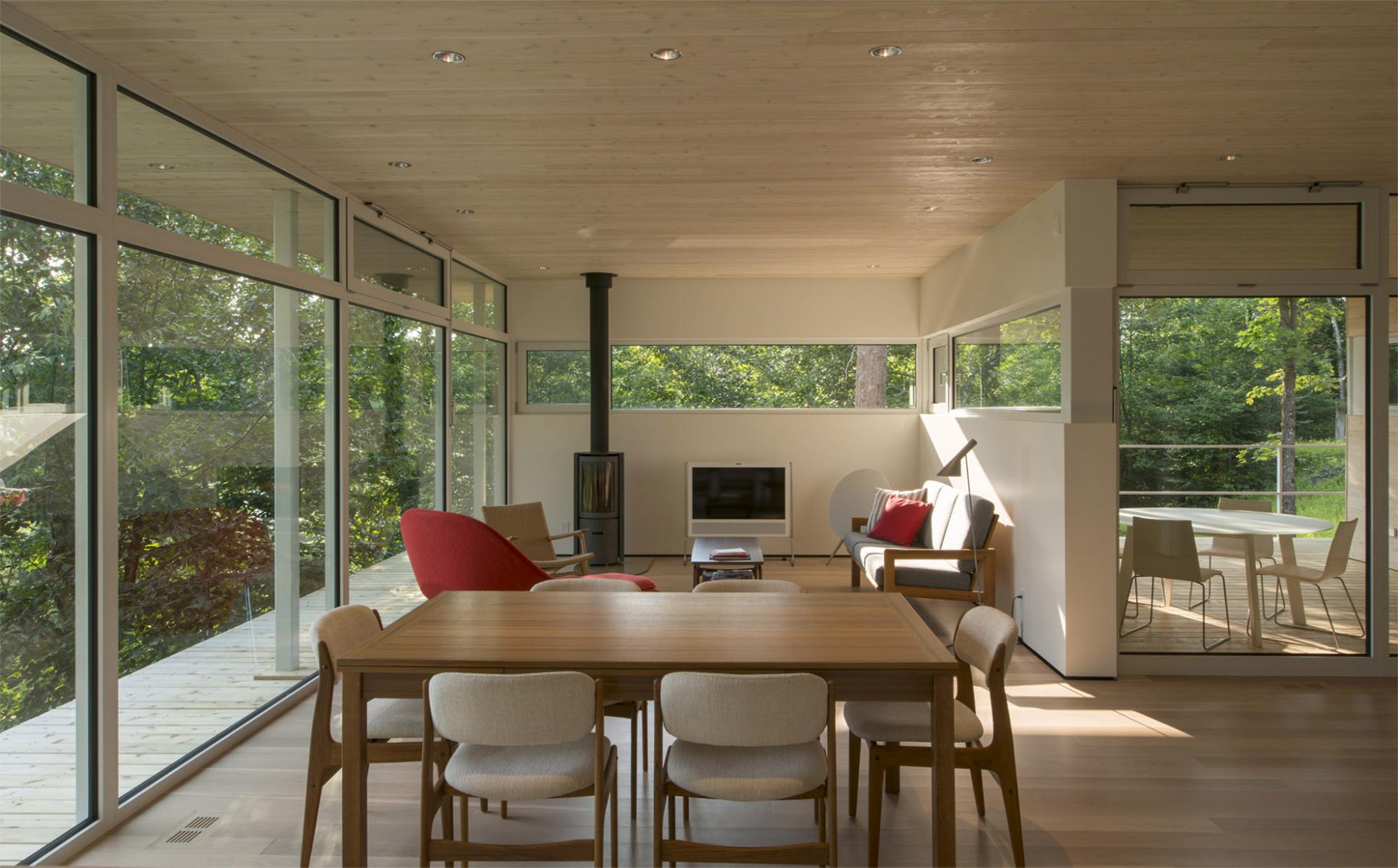 Beautiful dining interior of a modern cottage on Lake Huron. For more modern cottage designs, read our post!